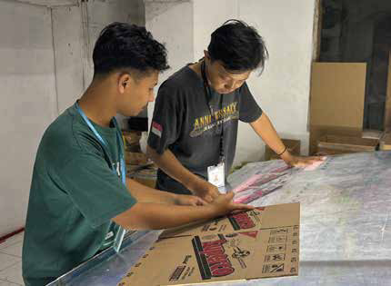 Workers mounting polymer plate